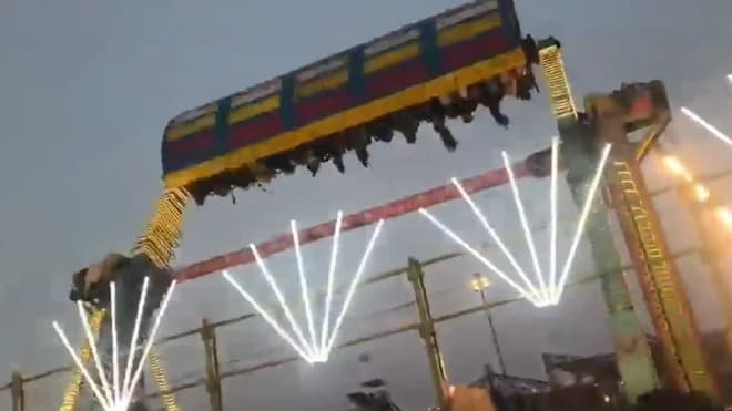 Imagen de la noticia: Tragedia en feria: Atracción mecánica se desploma y causa la muerte de un policía